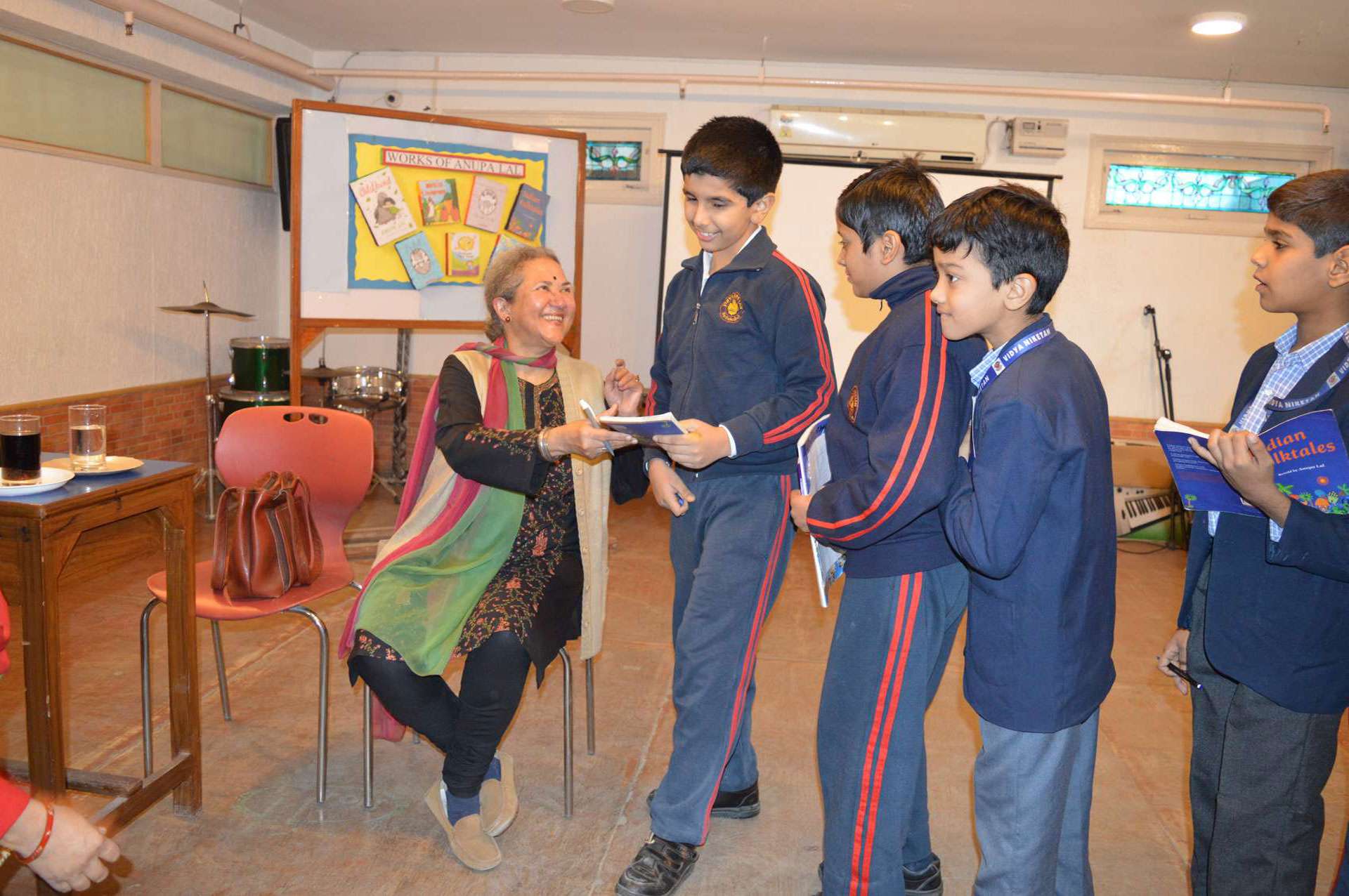 Author Ms. Anupa Lal encouraging children to read